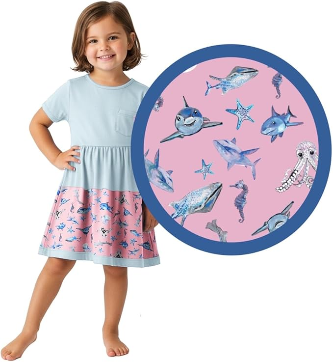 Child wearing a dress with shark pattern and inset showing fabric pattern