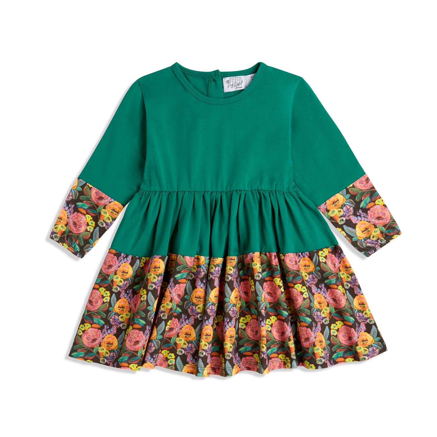 Best Twirly Dresses - Green - Flat lay of green long sleeve twirl dress for toddler girls; organic cotton garment by The Pink Picket Fence