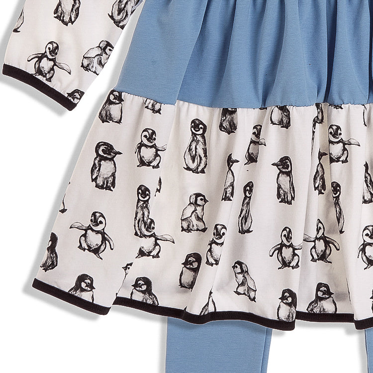 Blue and White Penguin Dress - Flat lay of toddler girl’s penguin-print dress with long sleeves and a twirl-friendly silhouette.