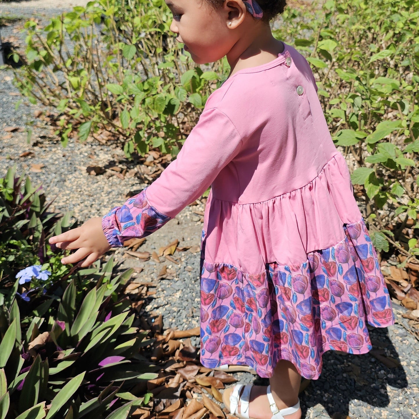 Long sleeve pink dress for toddler girls, perfect for spinning and everyday wear; handmade by The Pink Picket Fence