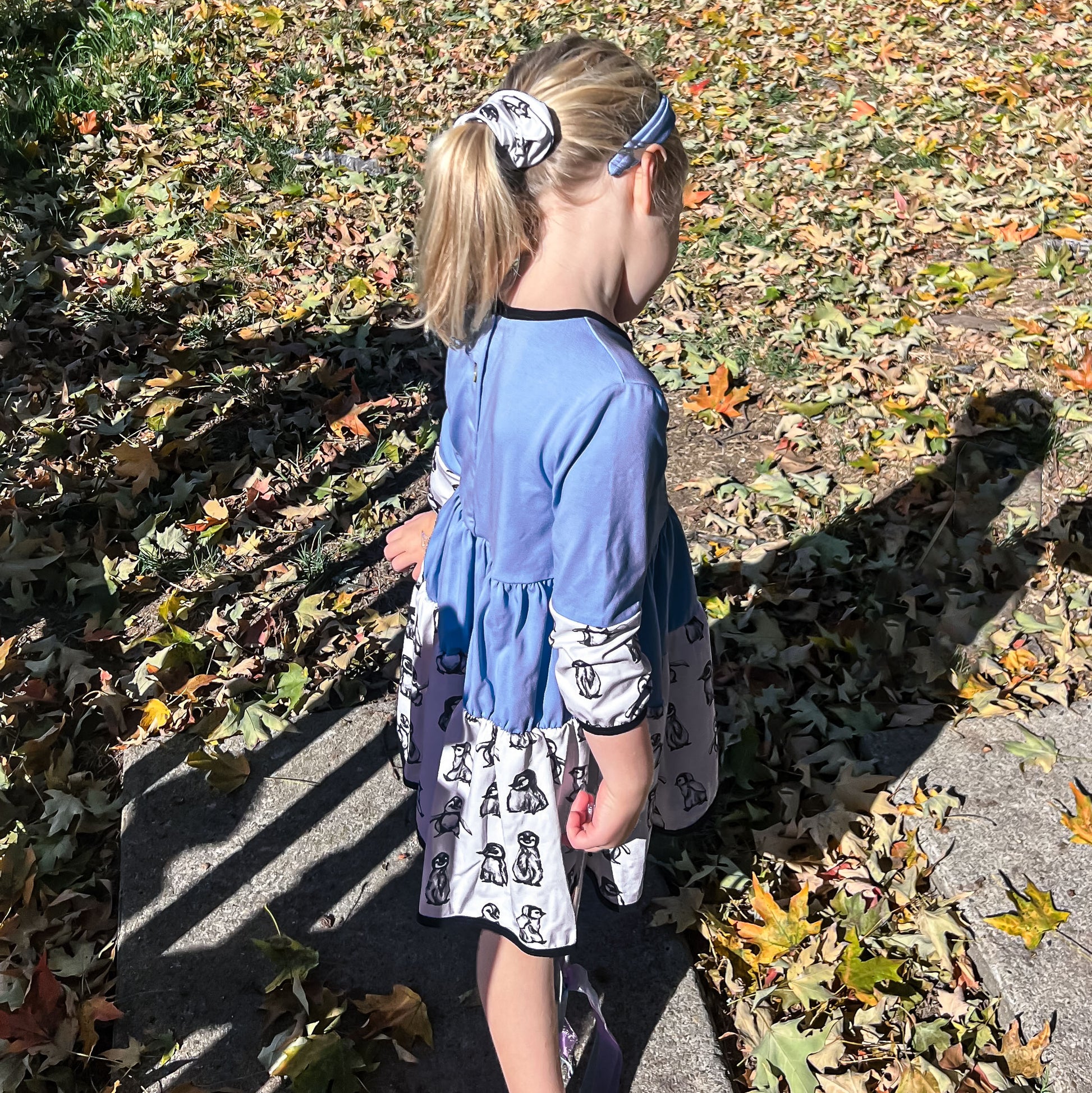 Girl Outside in Penguin Dress