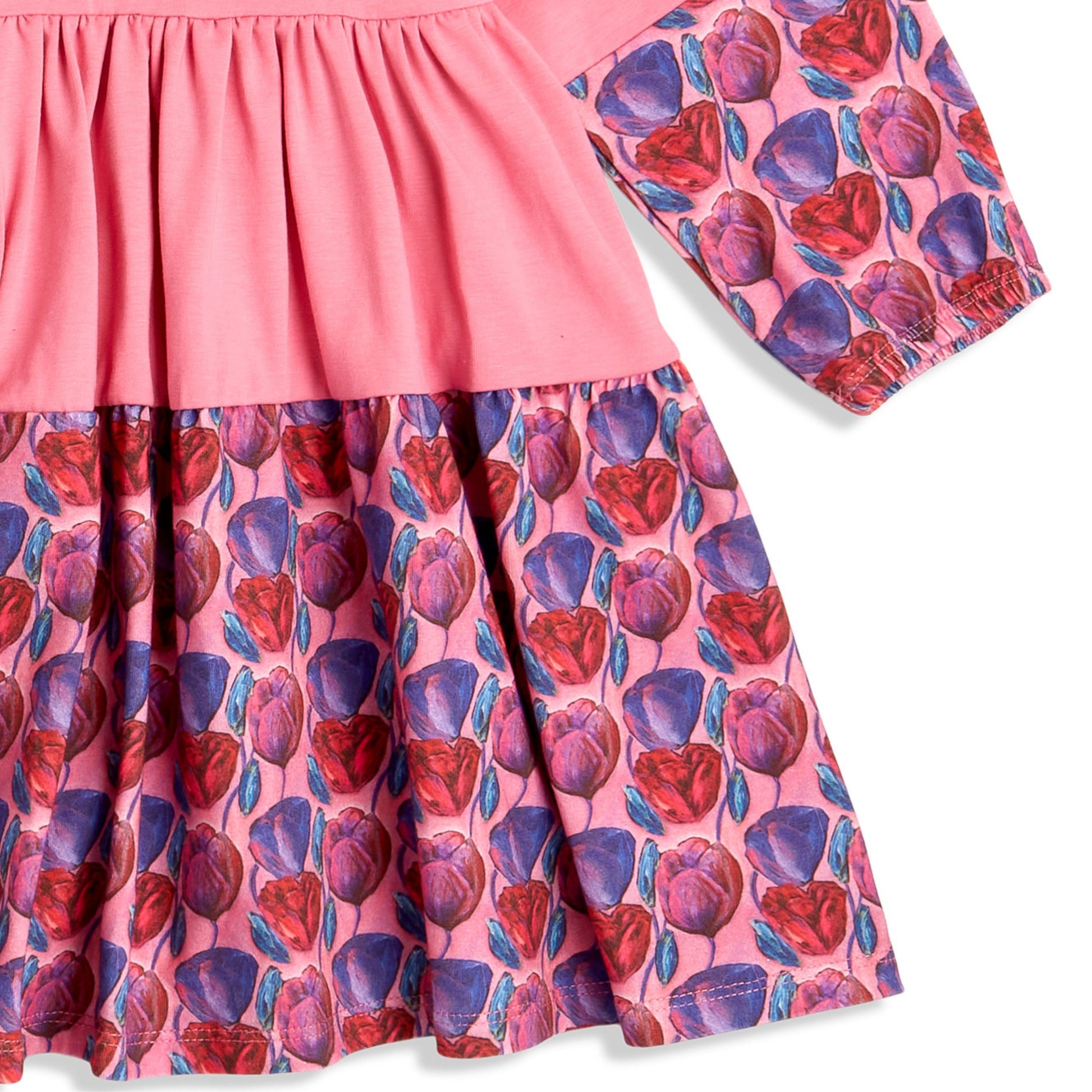 Soft pink twirl dress with long sleeves shown laid flat; original design for toddler and little girls clothing