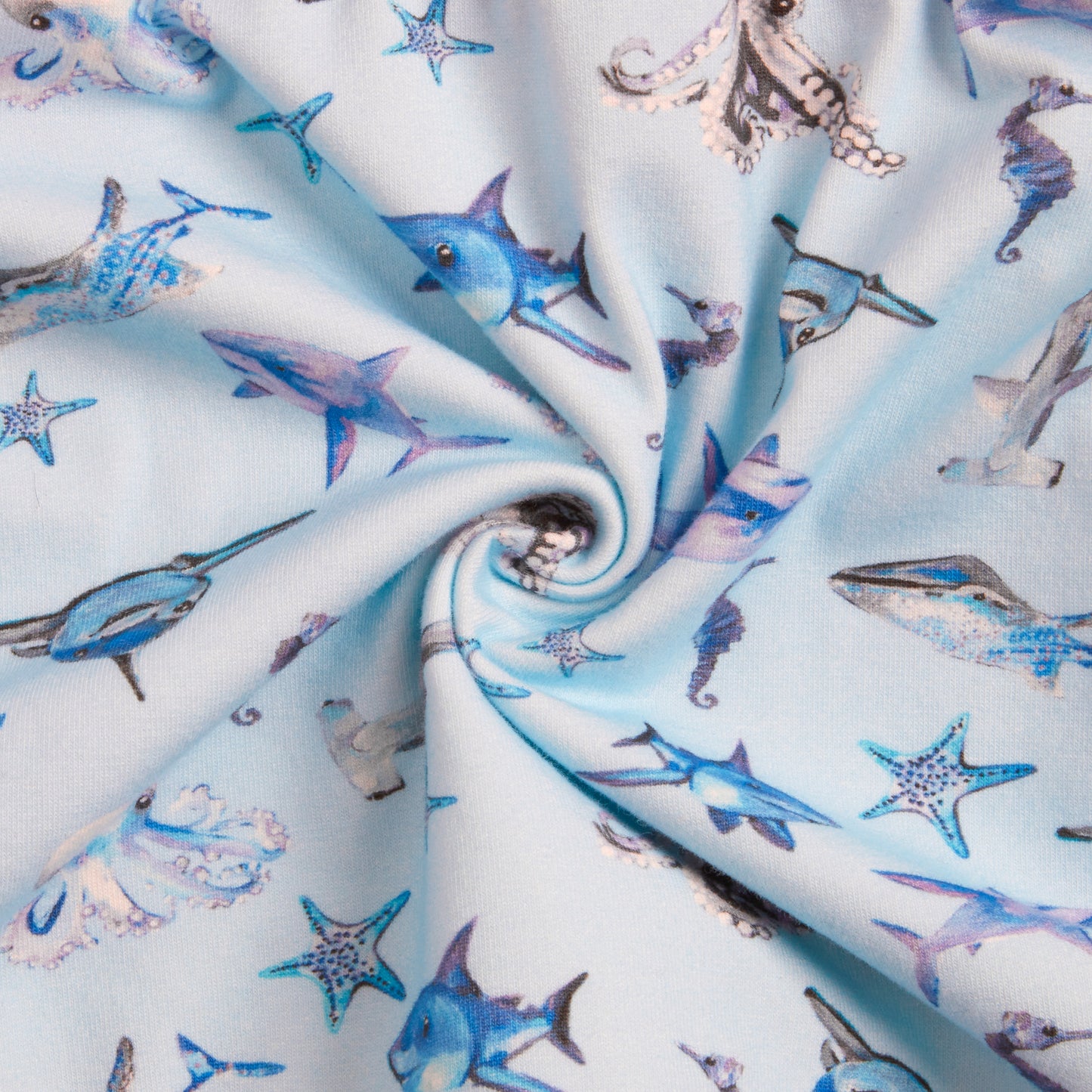 Close-up of blue underwater fabric pattern with octopuses, sharks, whales, seahorses, and starfish – soft 100% cotton for girls dress
