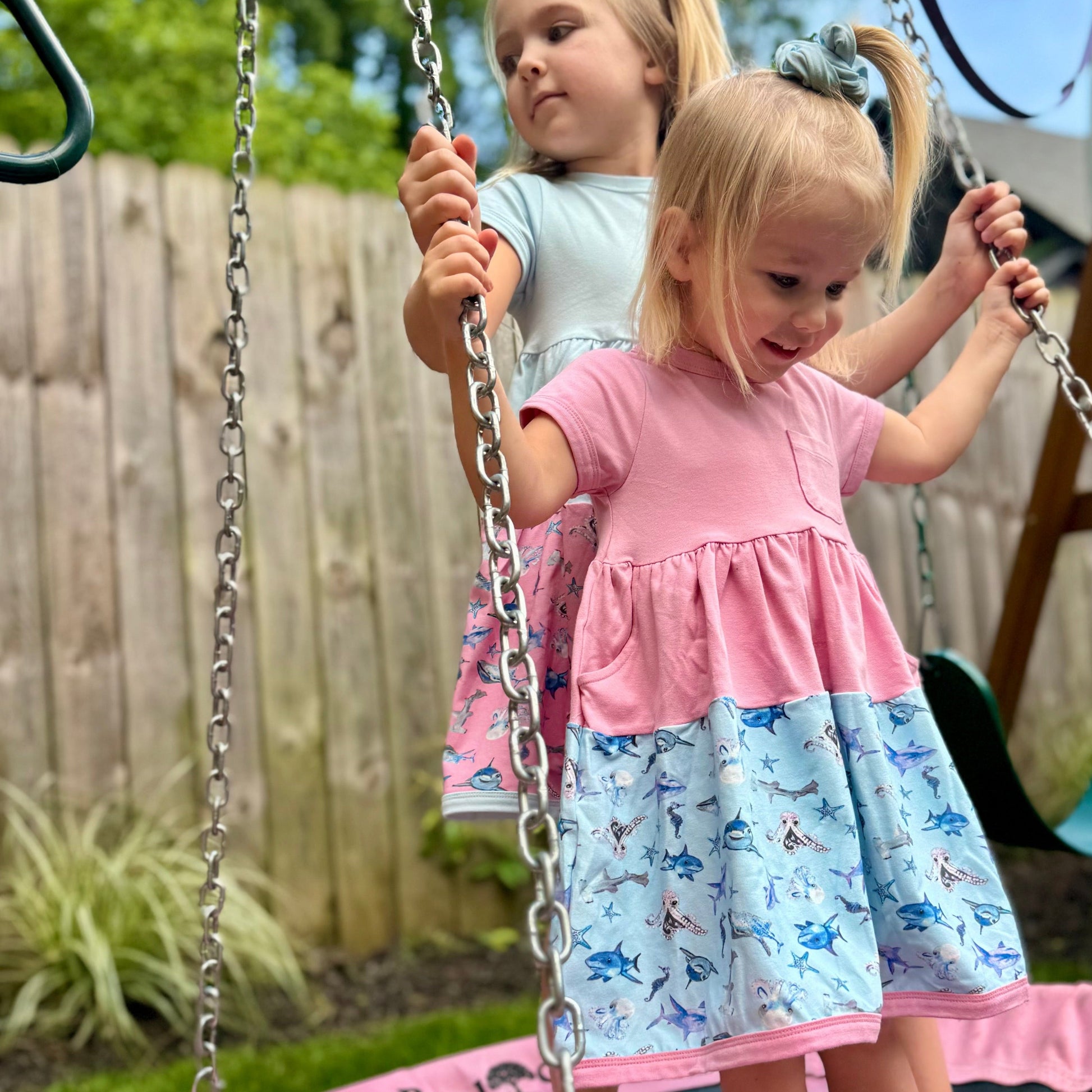 girl wearing shark twirl dress soft cotton sensory friendly kids clothing The Pink Picket Fence