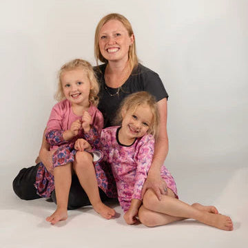 mom with two daughters wearing matching soft sensory friendly kids clothing The Pink Picket Fence