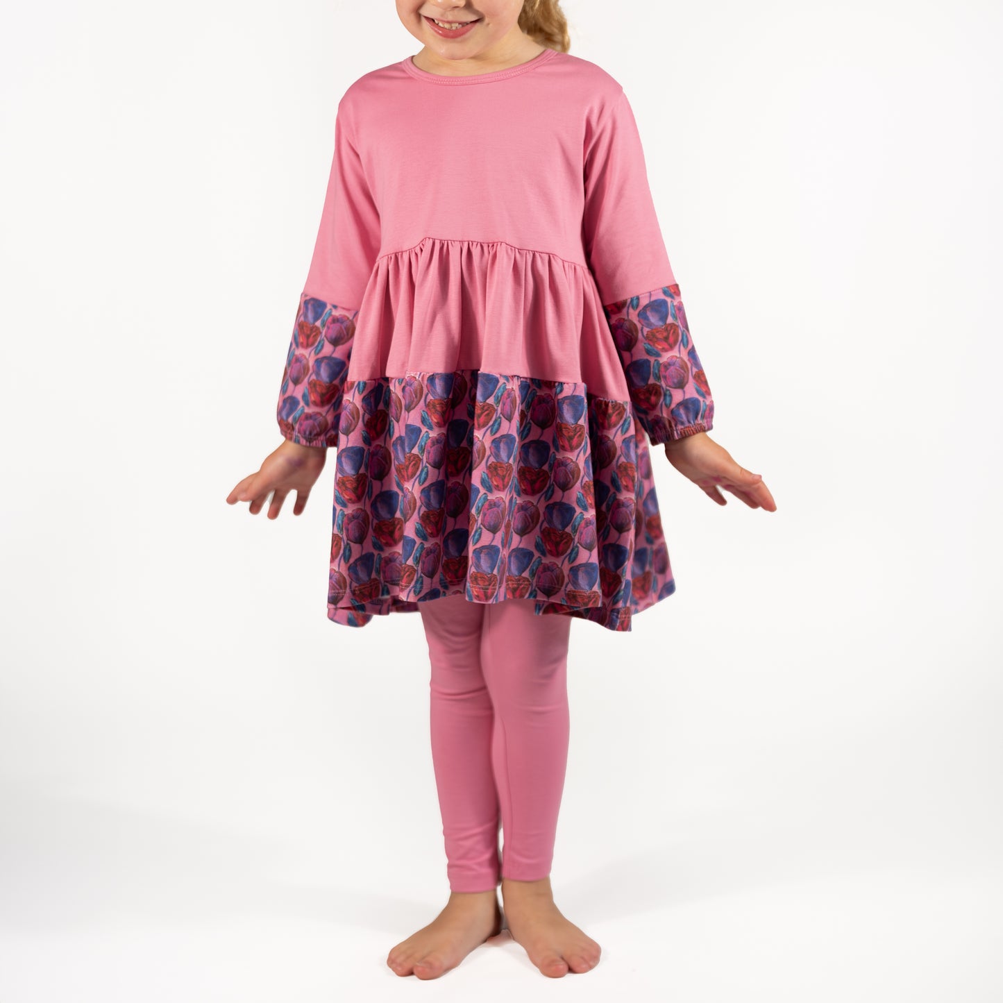 Soft pink twirl dress for girls shown in motion; ideal for playdates, photos, or casual wear