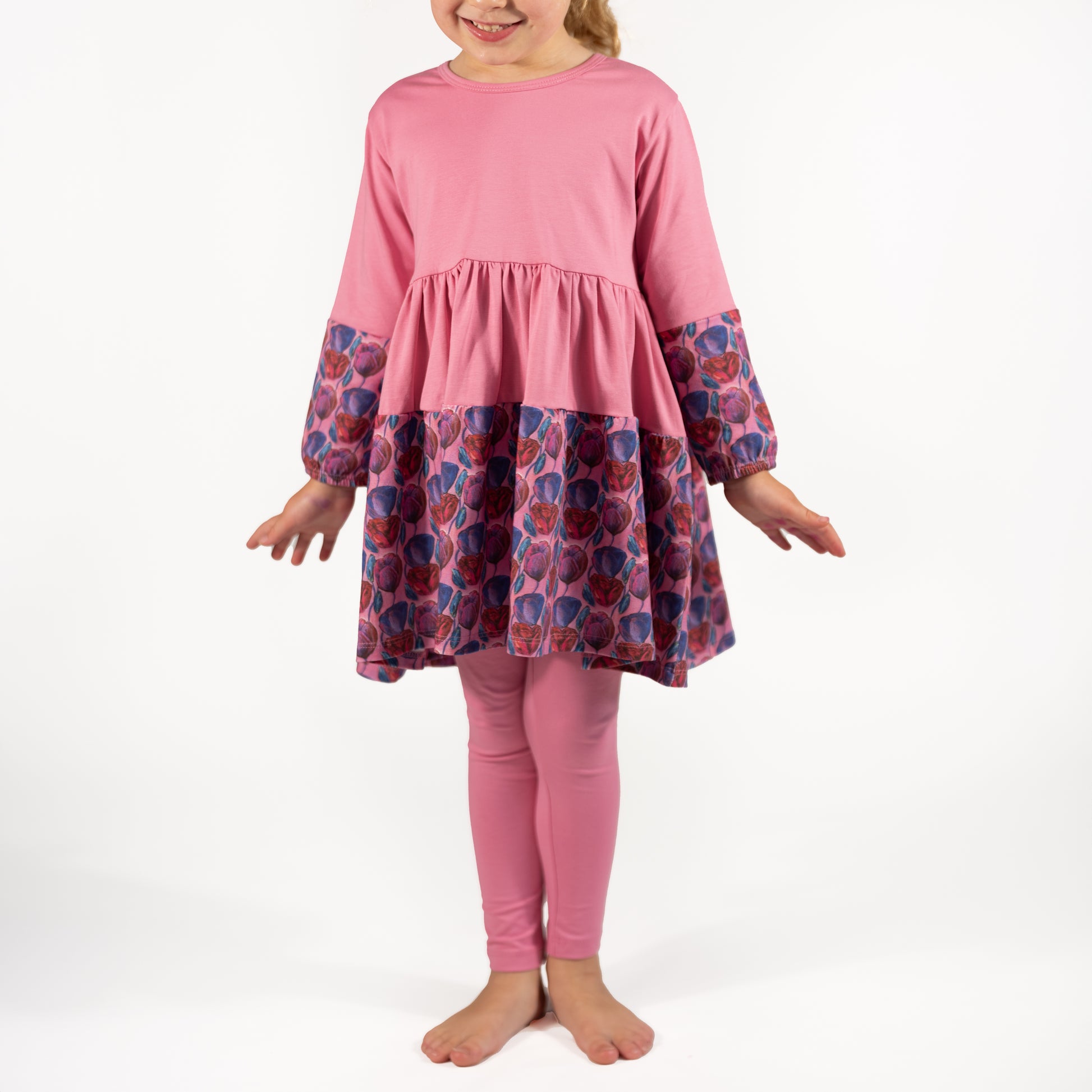Soft pink twirl dress for girls shown in motion; ideal for playdates, photos, or casual wear