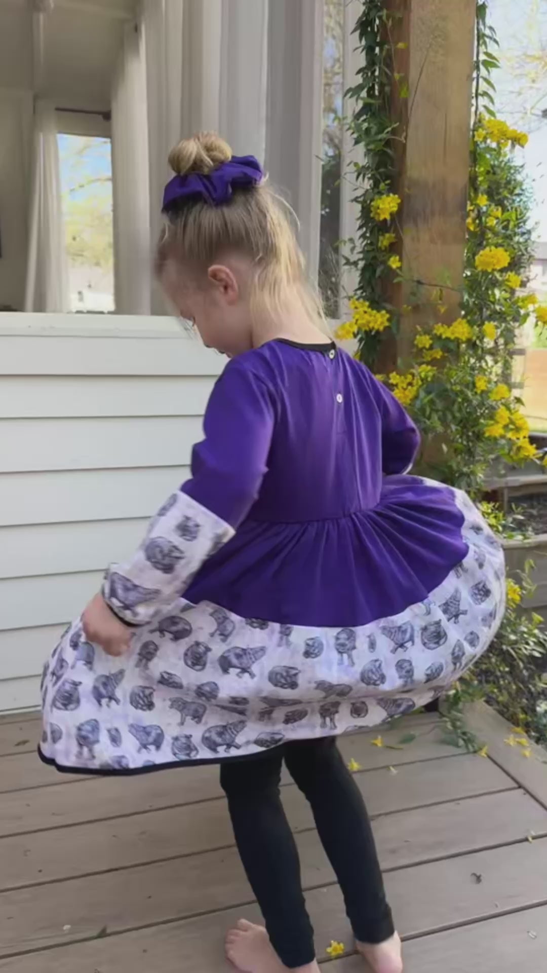 Sisters dancing in matching purple hippo dresses, made for twirling and everyday play.