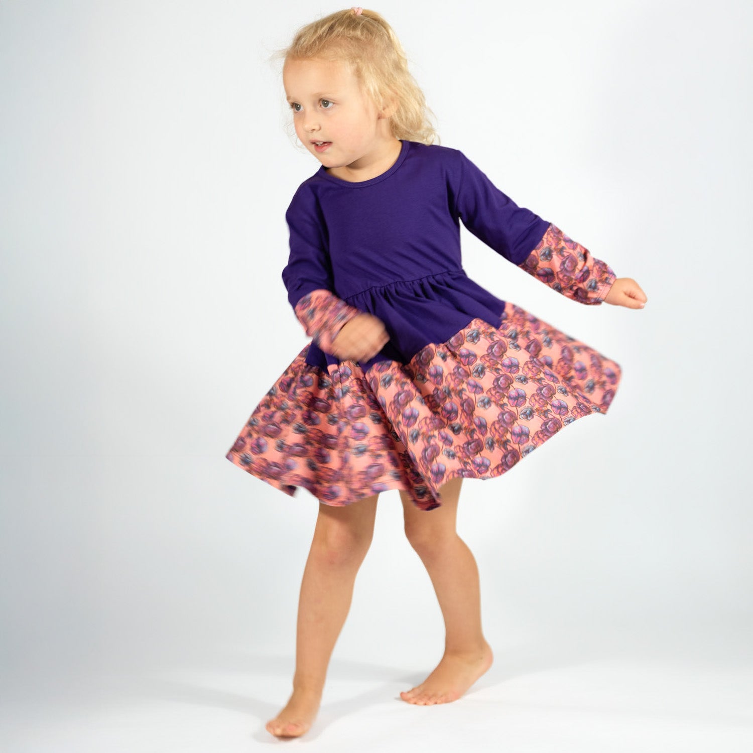 Twirly Girl Dresses - Child twirling in a soft purple dress with full skirt; organic cotton dress for toddler and preschool girls