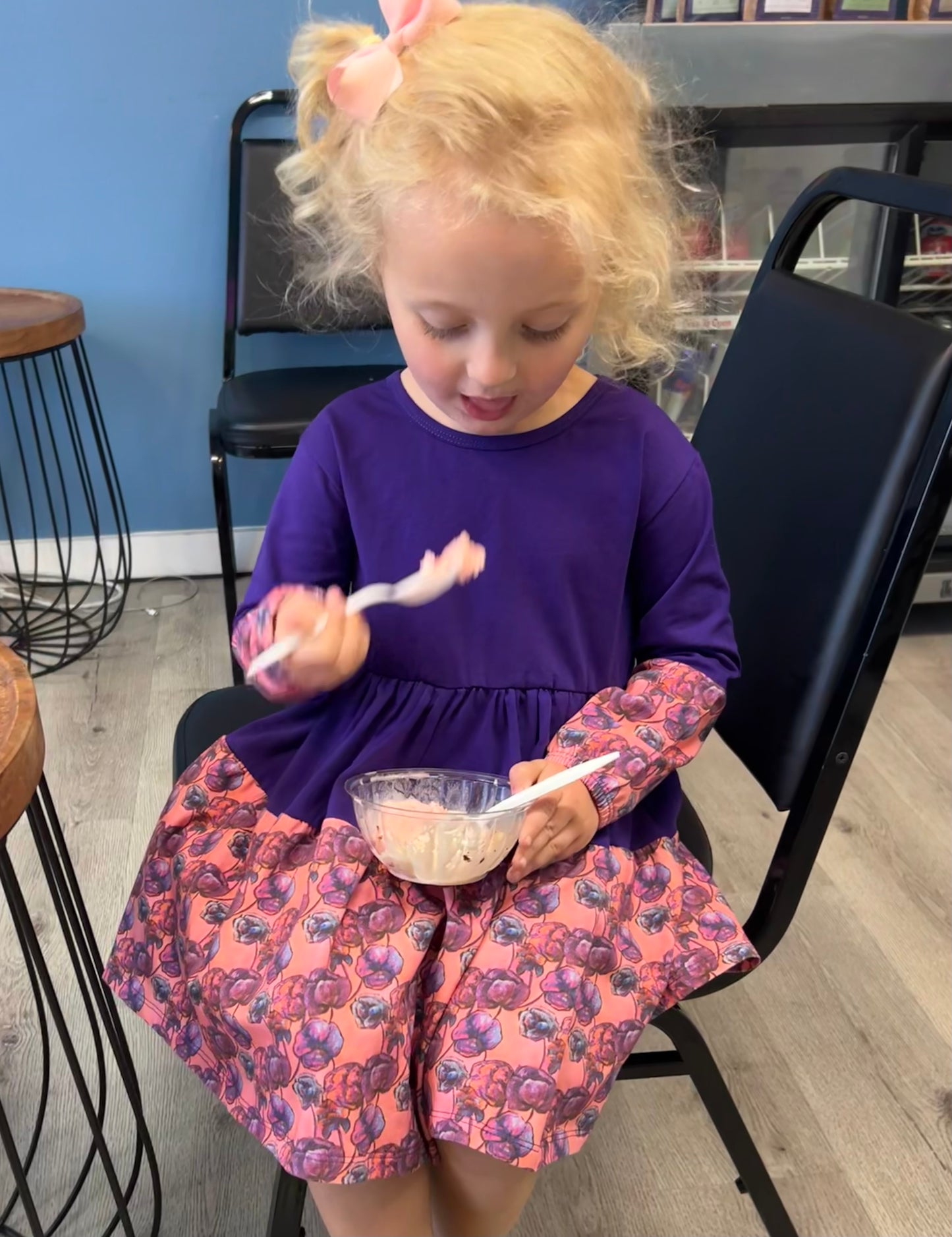 Girl Eating Ice Cream in Dress - Toddler girl twirling in a purple floral twirl dress; organic cotton dress for ages 2–6 by The Pink Picket Fence